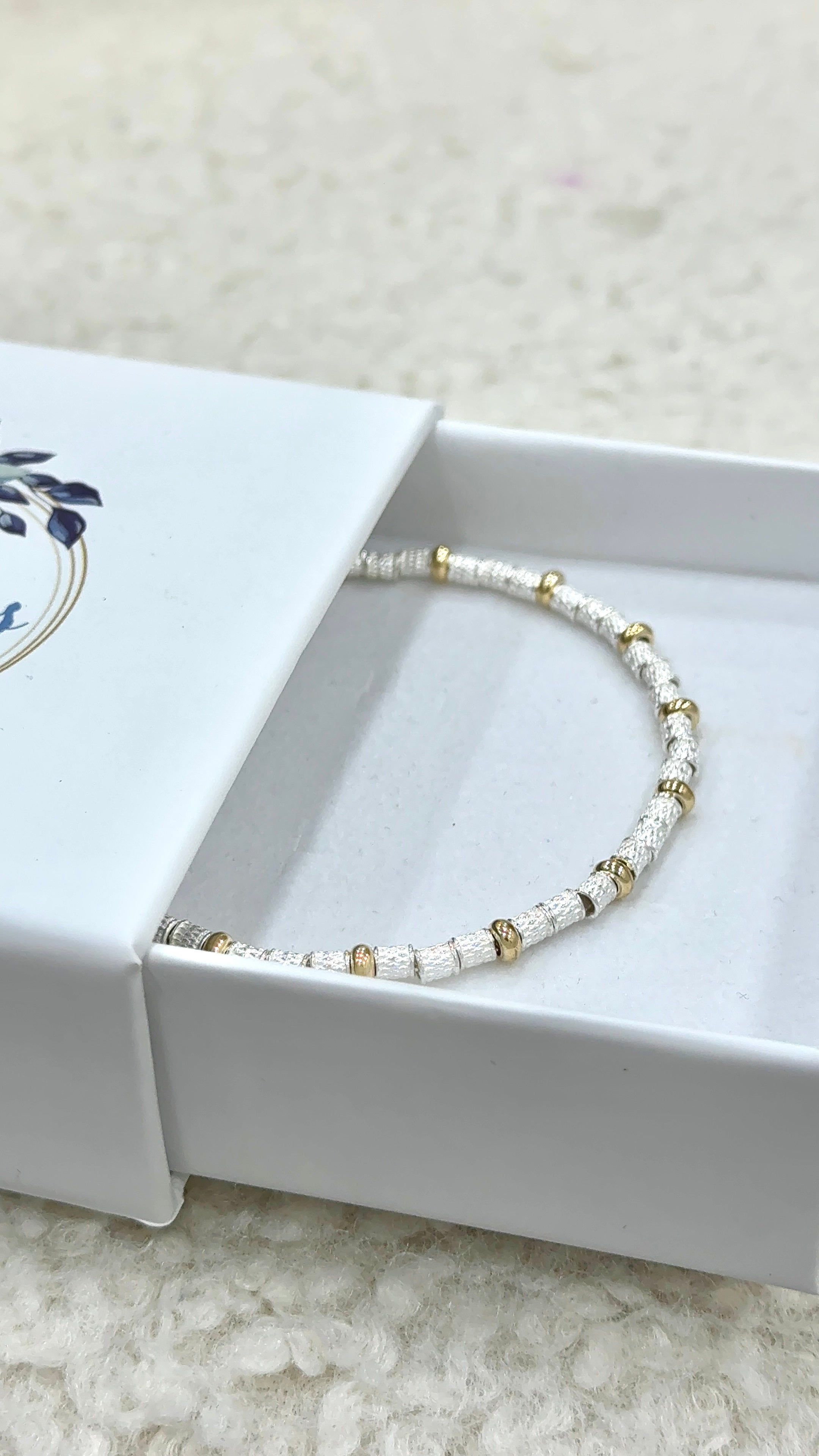 Bracciale sassolini diamantati e rondelline gold