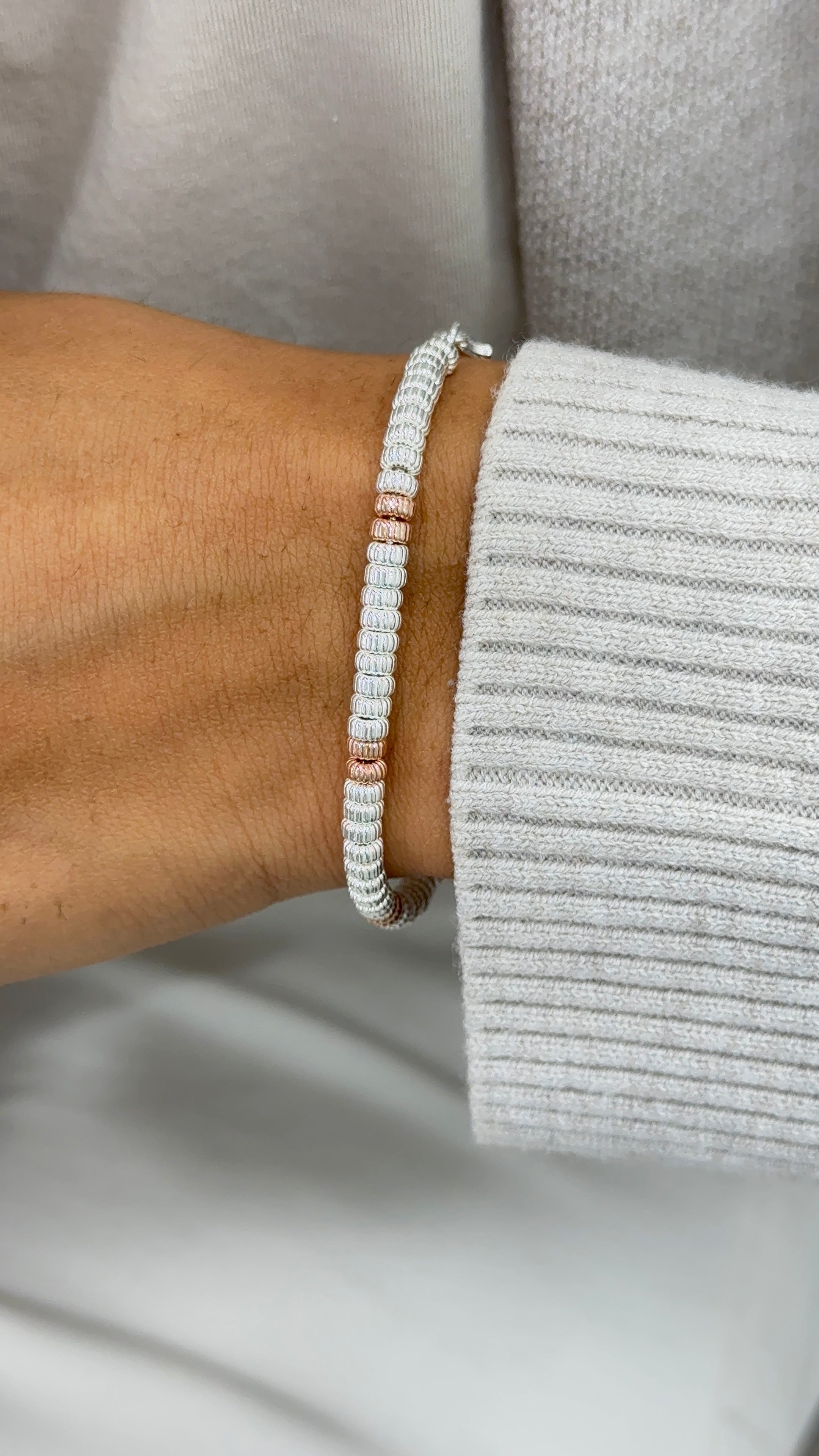 Bracciale rondelline rigate rosa gold